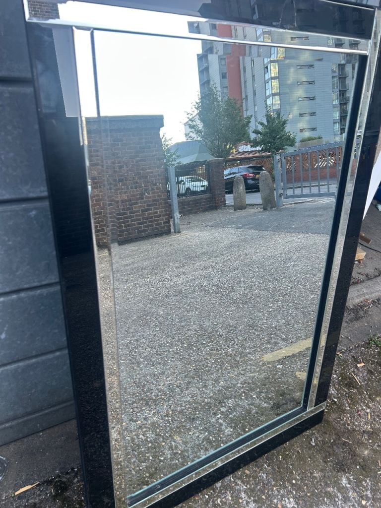 Large black framed mirror 