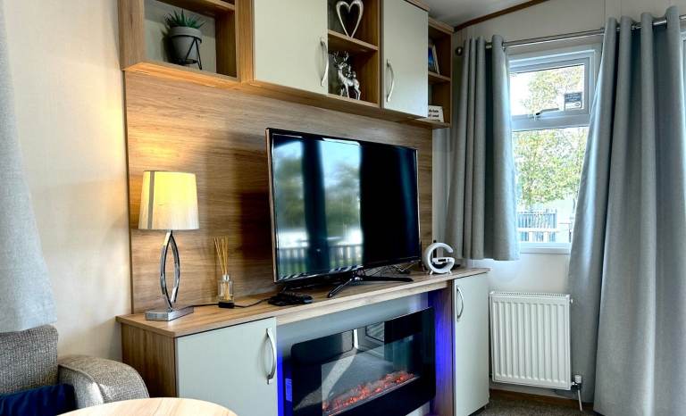 Own a caravan, repaying monthly, near Gt Yarmouth and Lowestoft