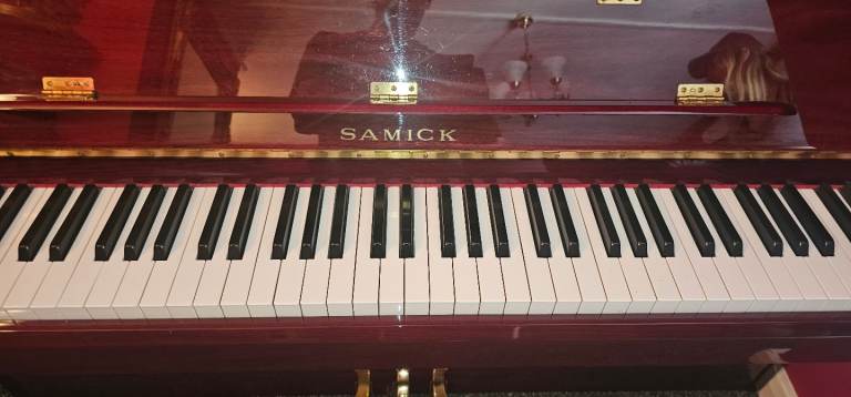 Superb Samick Piano. Lovely condition. With stool.