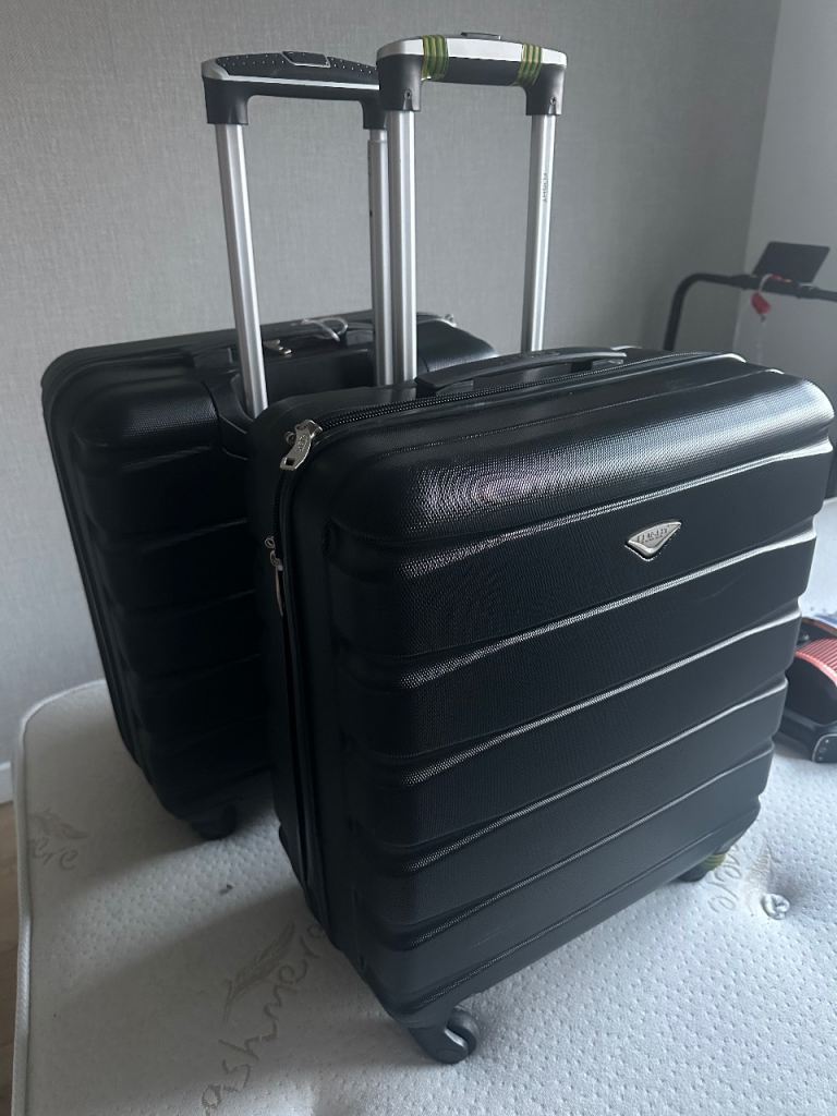 2 x overhead cabin size suitcases 