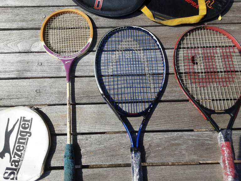 4 tennis rackets,  1 lady squash