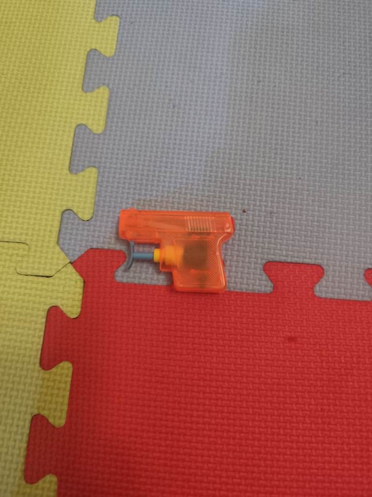 Small Orange Water Pistol Toy – Good Condition