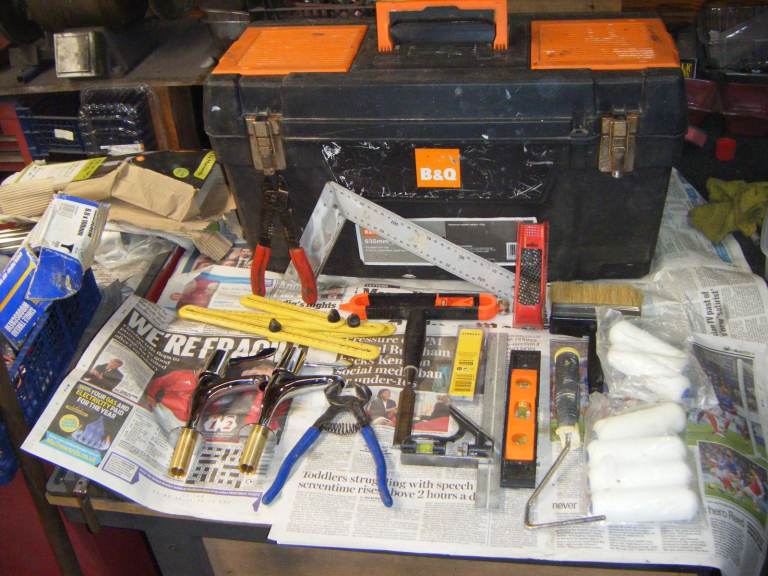 Large Tool Box, With assortment of tools, Including paint rollers.