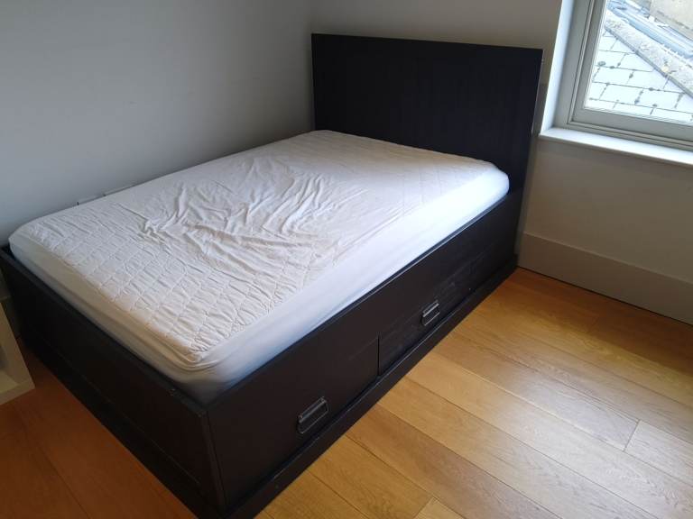 Wooden double bed with storage drawers and mattress 
