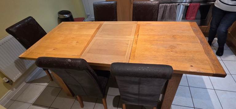 Oak extending table and 5 chairs