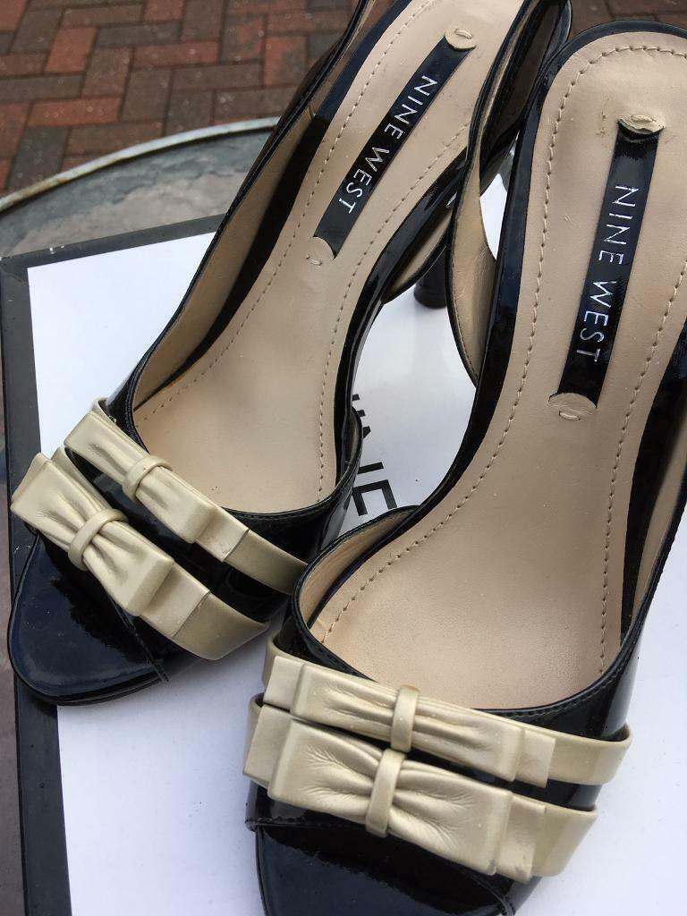 Nine West, black patent, sling back stiletto ladies shoes. Size 4