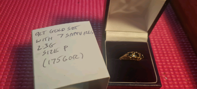 9ct carat gold ring set with 7 sapphires 
