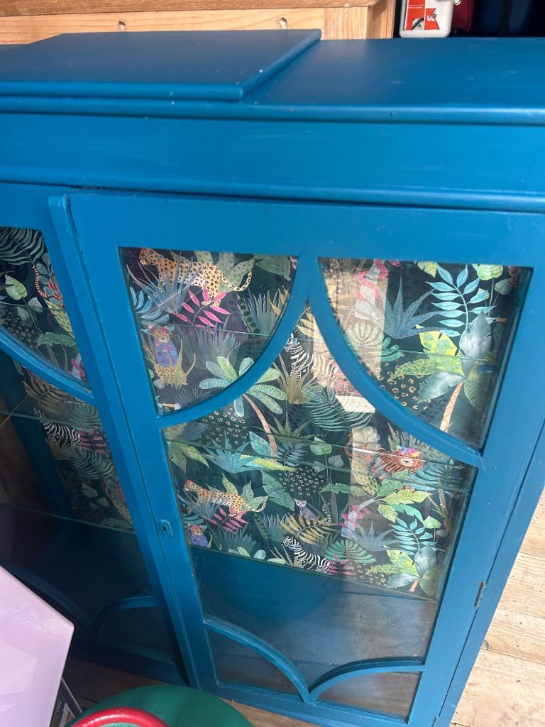 Teal Blue Display Cabinet with Jungle Print Backing