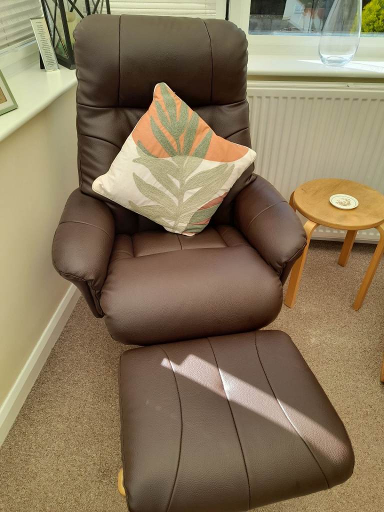 Brown faux leather recliner chair with footstool