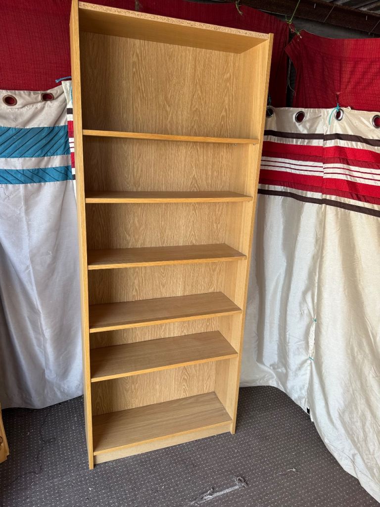 Pine effect tall bookcase can deliver 