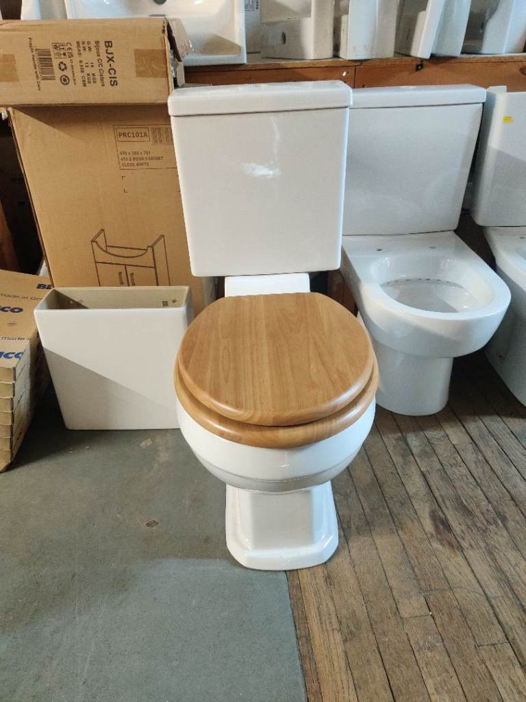 BN W/C TOILET WITH CISTERN AND WOODEN SEAT COVER