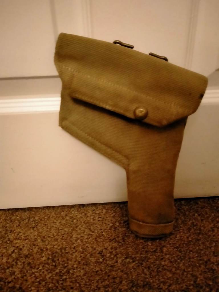 WW2 British Army crows foot marked 1943 Canvas Holster, with brass belt fitting on rear.