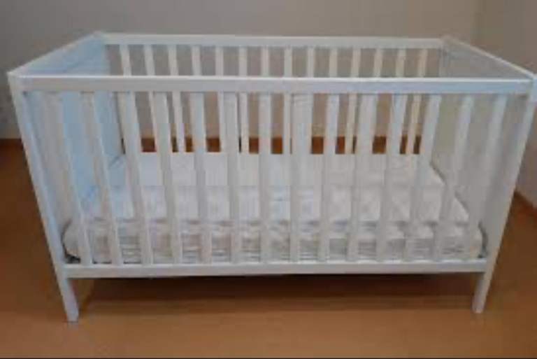 White baby crib