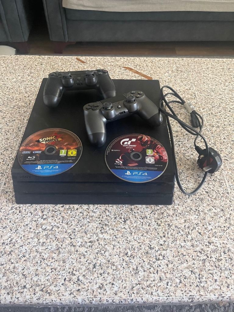 Ps 4 pro with two controllers cables and CD’s 