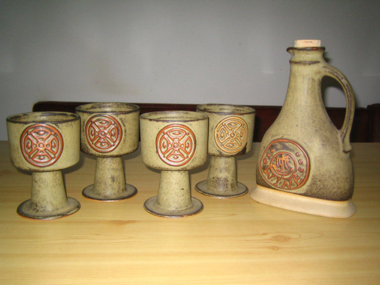 POTTERY GOBLETS AND MATCHING CARAFE 