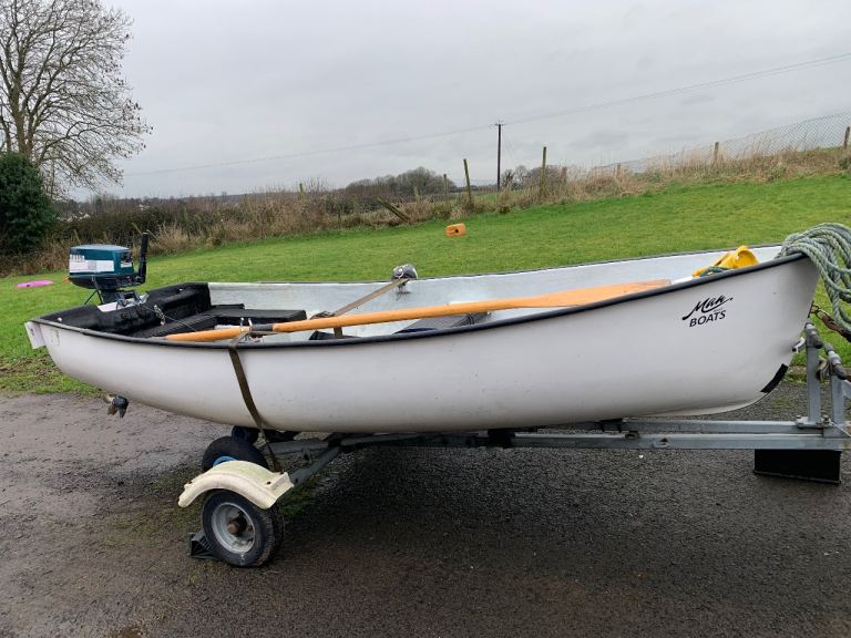 12 ft fibreglass boat trailer oars and 2 outboards 