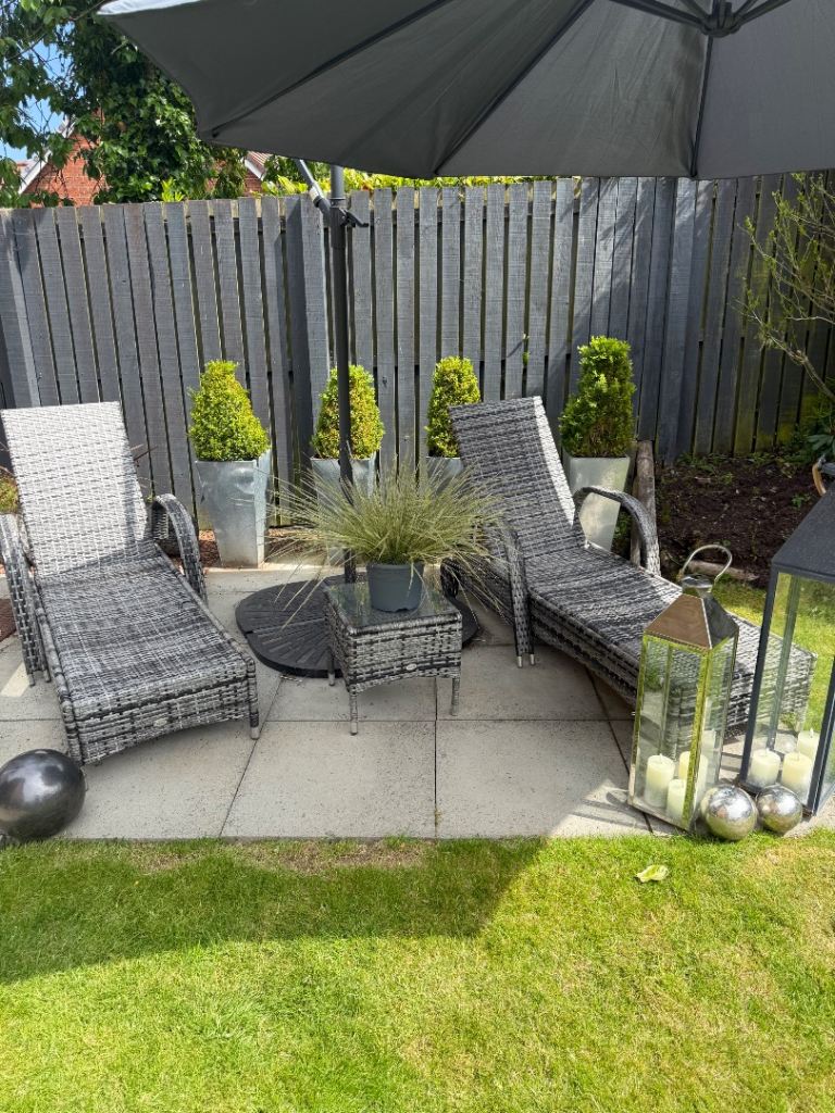 2 grey Rattan loungers with side table 
