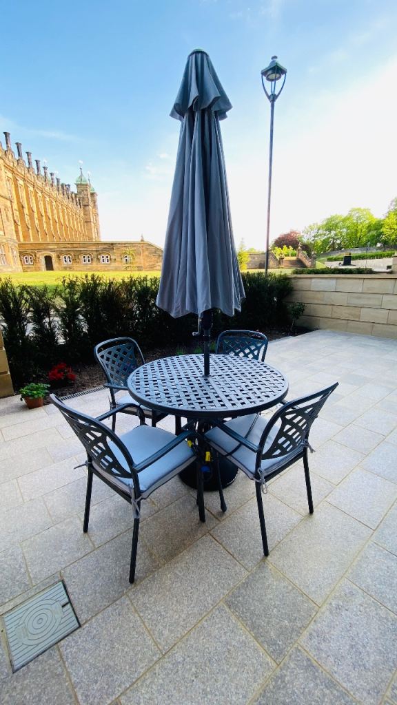 Garden table with four chairs & parasol