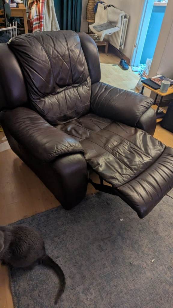 Large faux leather brown manual reclining chair