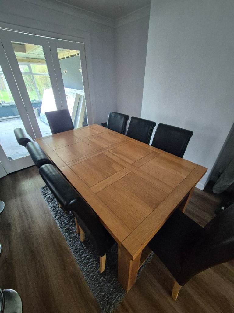 Solid oak extendable dining table and 8 chairs