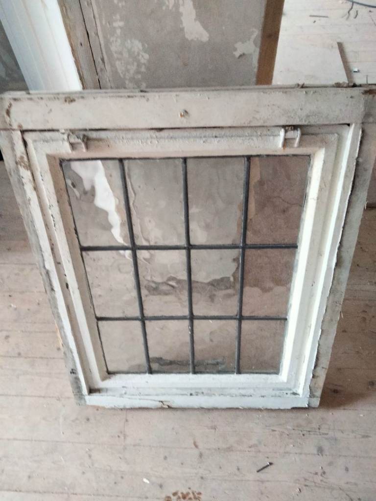 Old wooden window frame with opening sash 