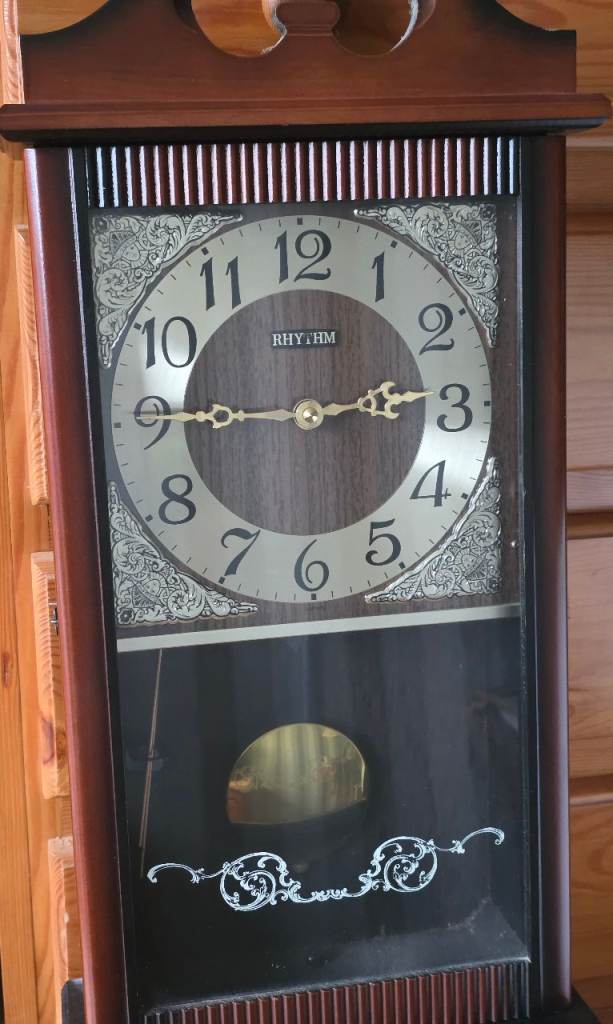 Rhythm wooden pendulum wall clock 