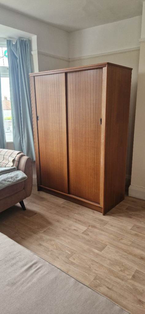 Good Condition Brown Wooden Wardrobe with Smooth Sliding Doors
