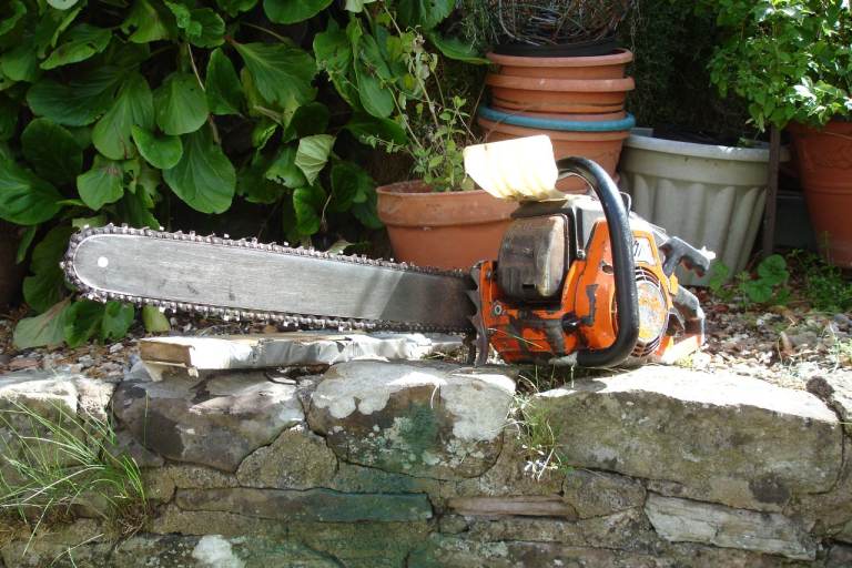 Chainsaw O M old petrol chainsaw