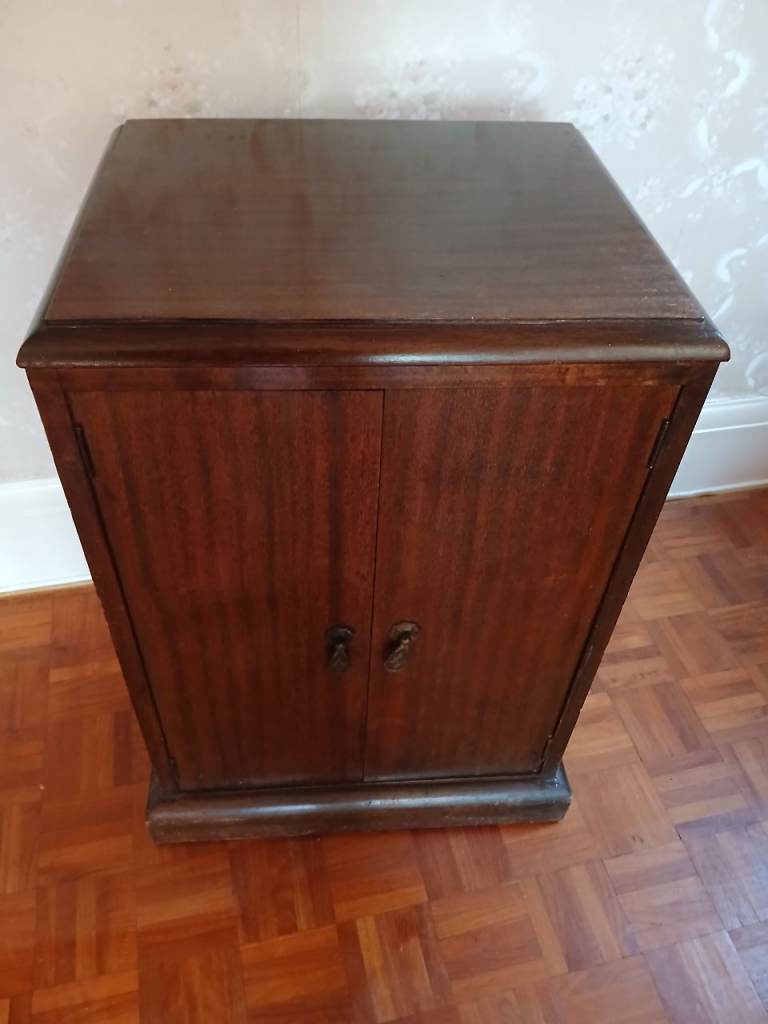 Vintage Music mahogany music cabinet with folding front drawers.