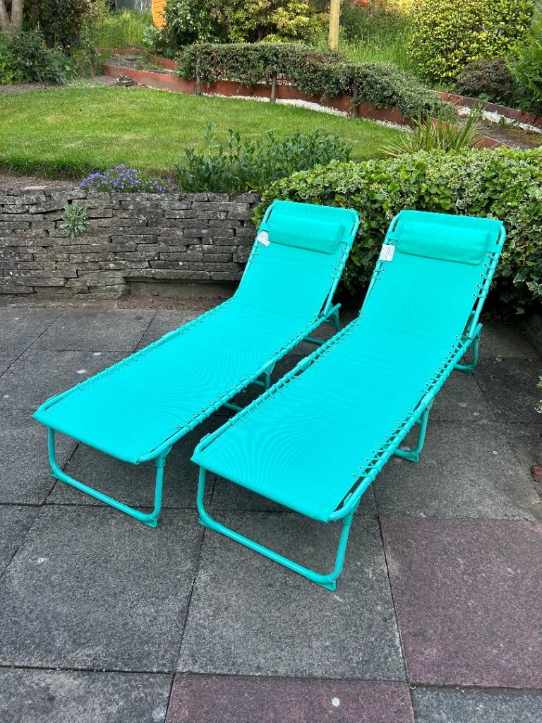 Sun loungers, sold as a pair