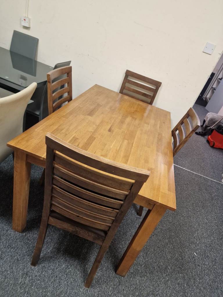image for Oakwood dining room table and 4 rail back chair only £149