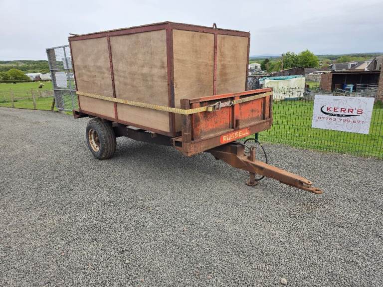 Tractor tipping trailer with grain / feed box 