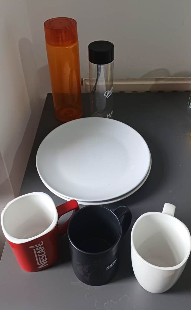 Plates , coffee mugs , water bottles