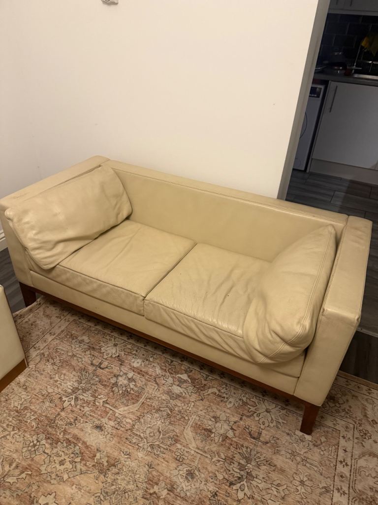 Cream leather teak base sofa 