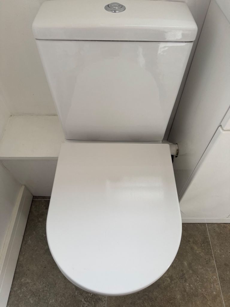 White Toilet with Cistern and Seat – Good Condition