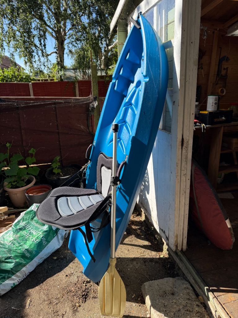 Blue Kayak with Paddle and Seat – Good Condition