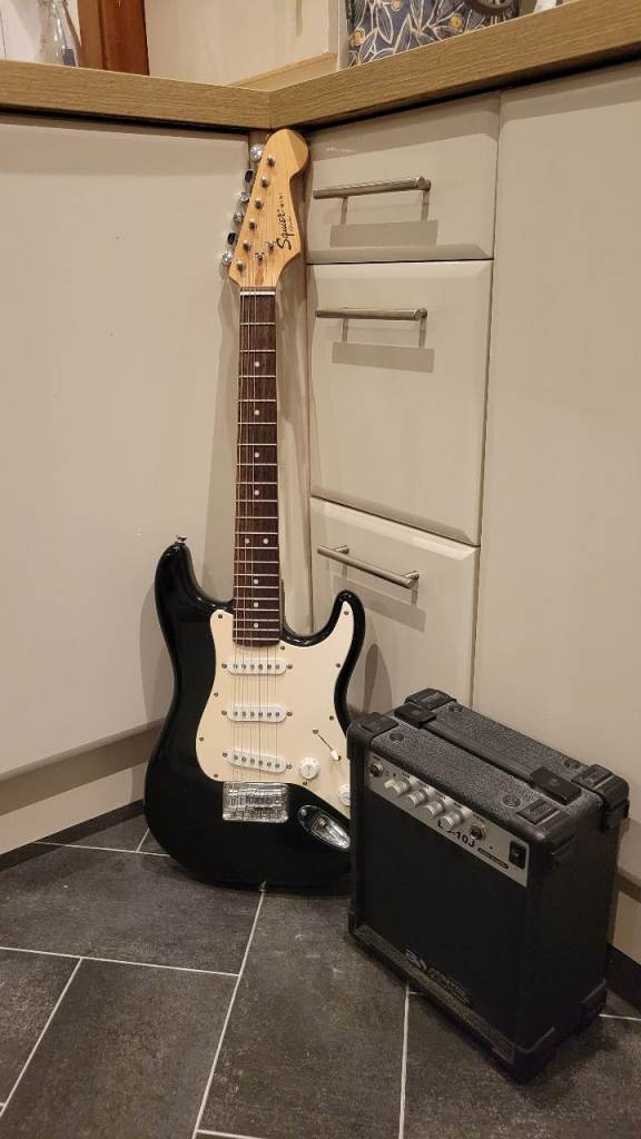 Squier mini stratocaster electric guitar and amplifier 