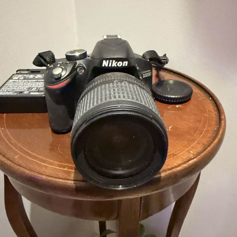 Nikon D3200 with 18–105mm VR lens, charger and carry case