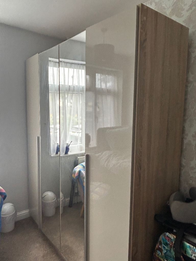 Large glossy beige four door wardrobe 