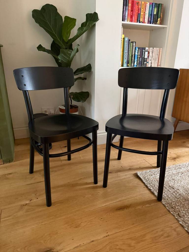 Pair of black dining chairs