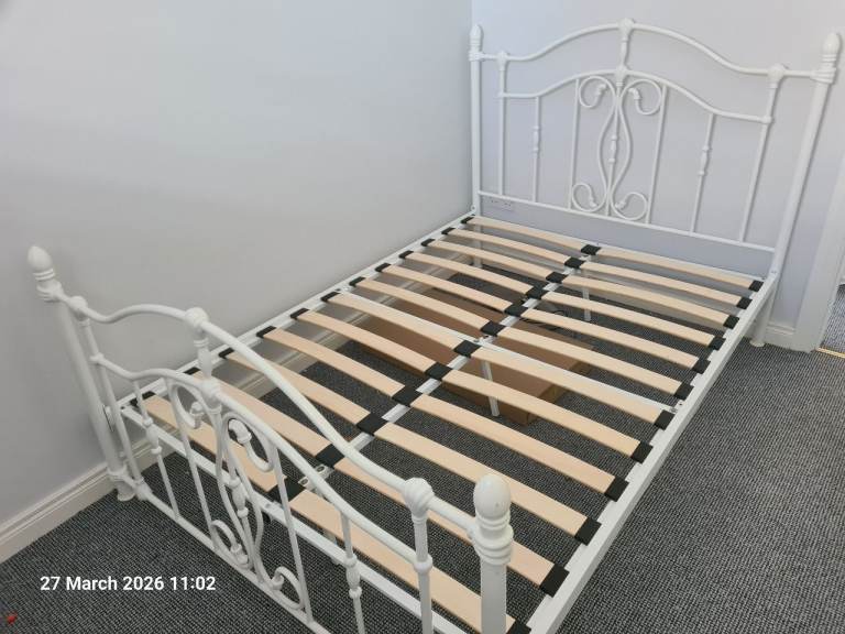 White cast iron double bed