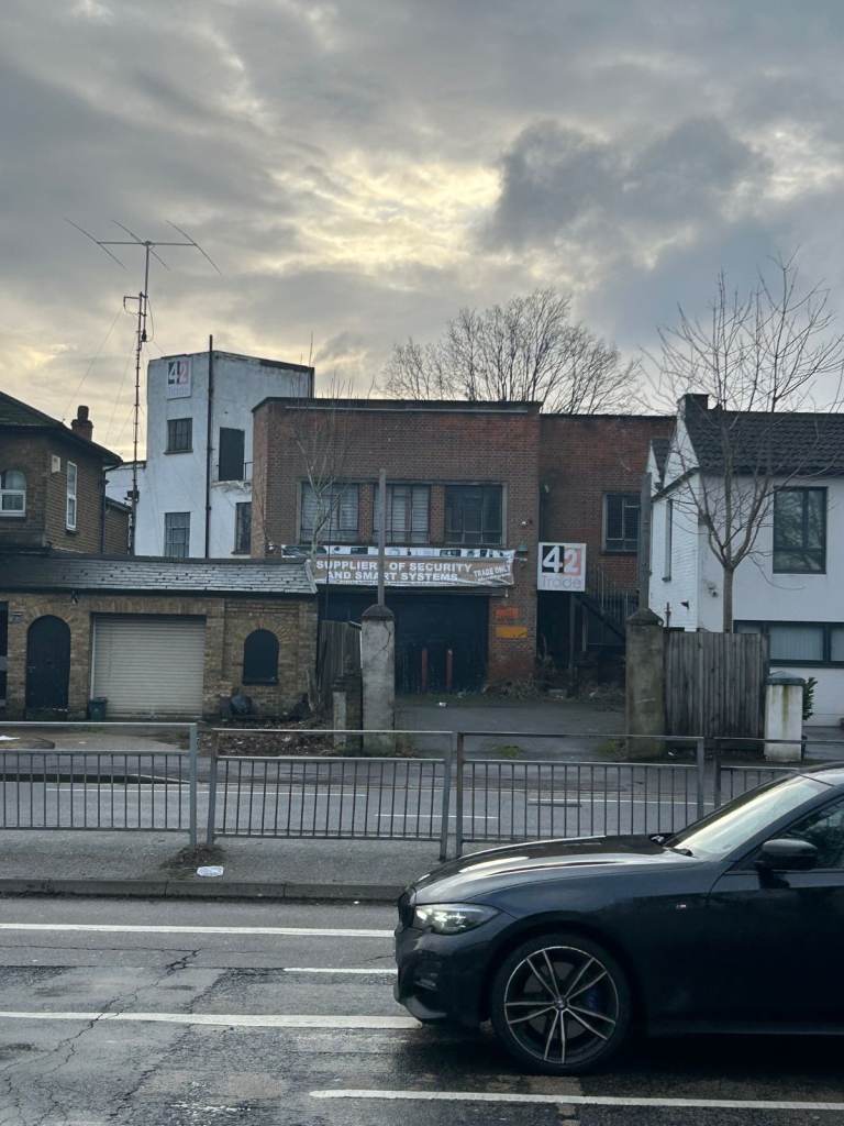 spacious garage with parking for 2 cars outside and back yard 