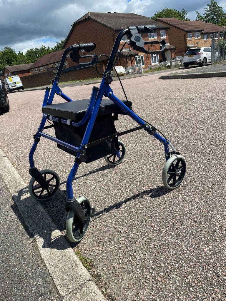 Blue Mobility Walker with Seat and Storage – Good Condition