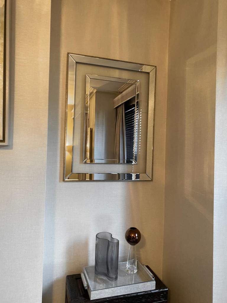 Pair of designer mirrors or will sell separately in Champagne frame featuring floating glass mount