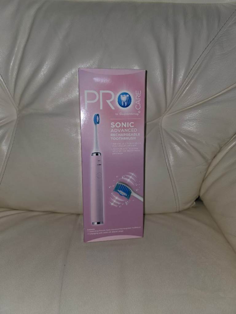 Brand new pink electric toothbrush
