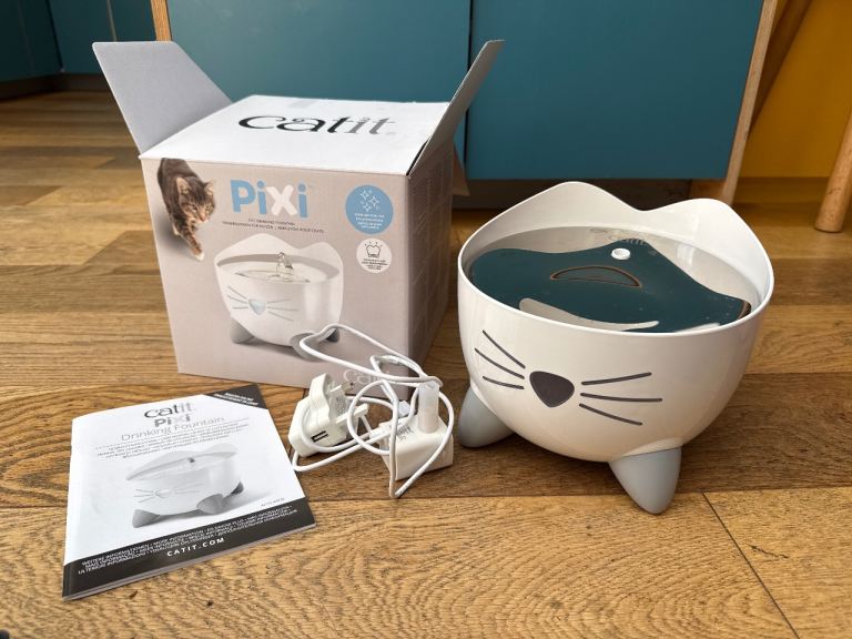 Cat drinking fountain