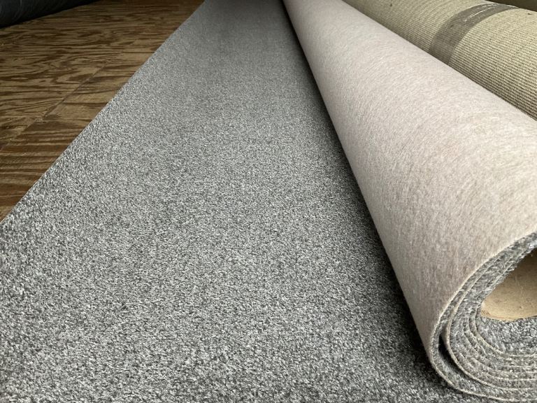 New 3.85 x 4m felt backed carpet.