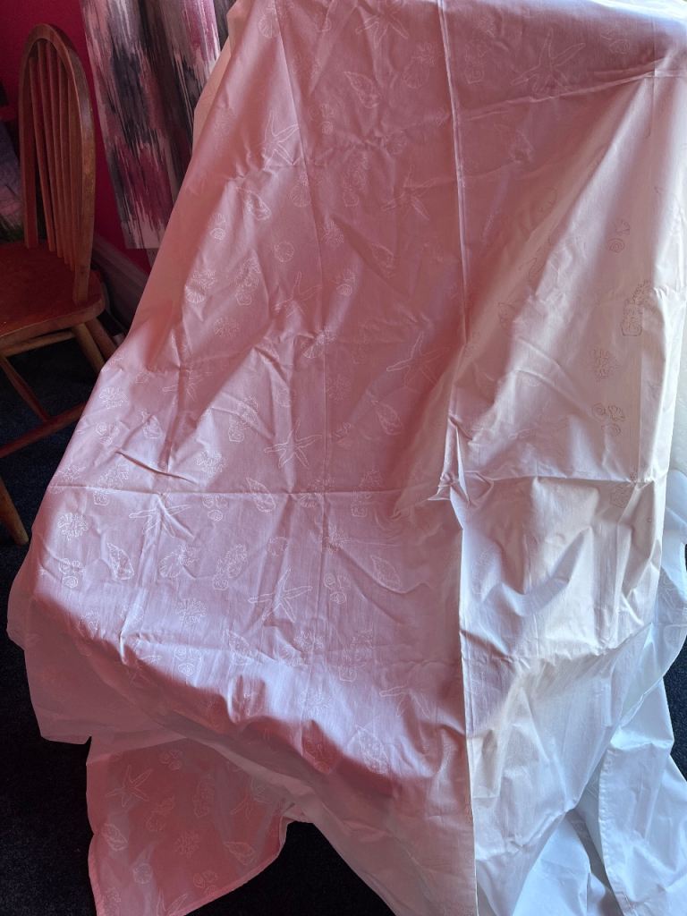 White shower curtain with faint pattern 