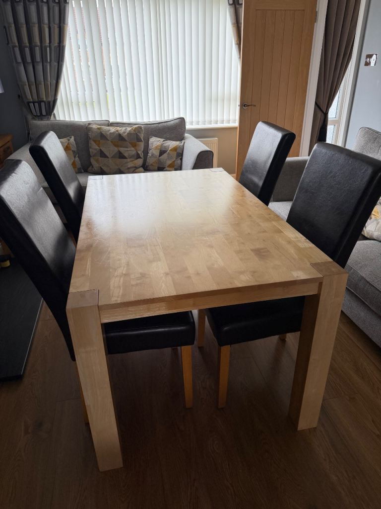 Wooden Dining Table with Four dark brown faux leather chairs - Great  Condition