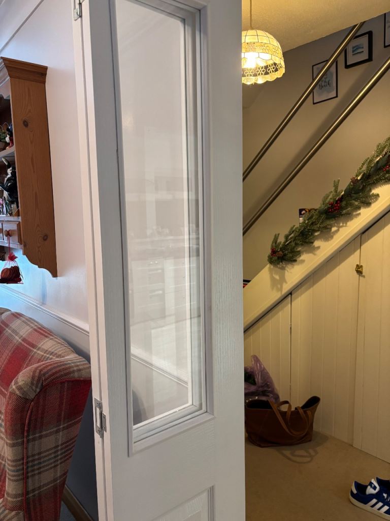 Unused White bi-fold half glazed door. (1 Trim damaged ) 